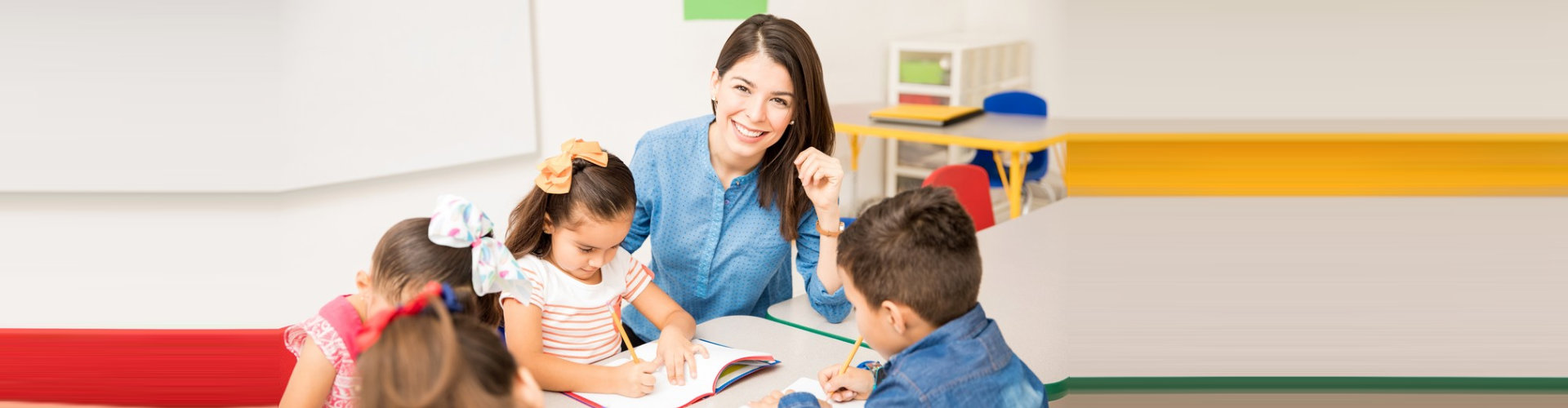 Adult smiling and playing children