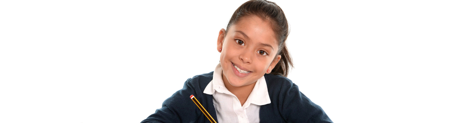 female child writing homework with pencil smiling